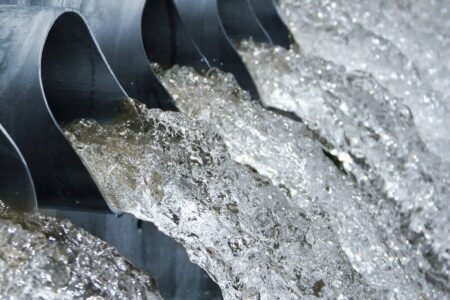 Water flows out of sewage pipes