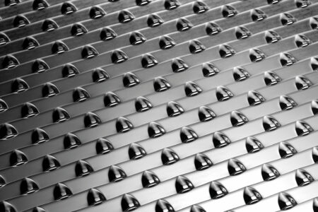 Hein Lehmann - CONIDUR® perforated plates with special conical holes for improved flow, reduced clogging, and high wear resistance in industrial applications.
